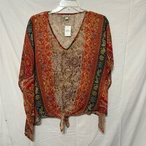 One World sheer pointed hem poncho in a multi-colored floral and paisley pattern